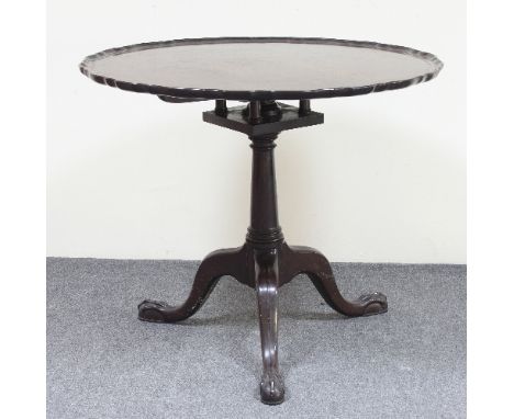 A George II style mahogany tripod table, the piecrust top on bird cage topped column with claw and ball feet, 83cm diameter/P