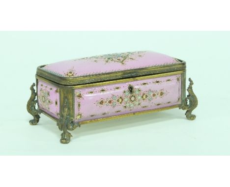A French pink enamel box with 'jewelled' decoration and gilt metal mounts on scroll feet