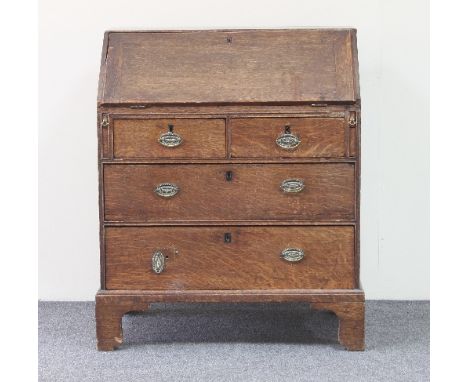 An 18th Century oak bureau, the fall above two short and two long drawers on bracket feet, 75cm wide  Condition Report: Condi