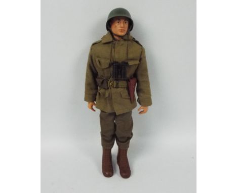 Palitoy, Action Man - A Palitoy Action Man figure in Combat Soldier attire with GI Joe Jacket. The red painted hard head figu