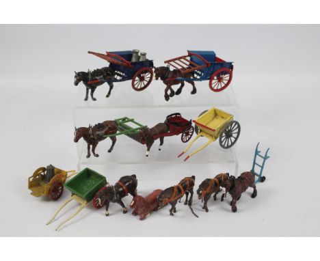 Britains - Charbens - A group of metal Horses and carts including a Charbens milk cart with one churn, a Britains Horse with 