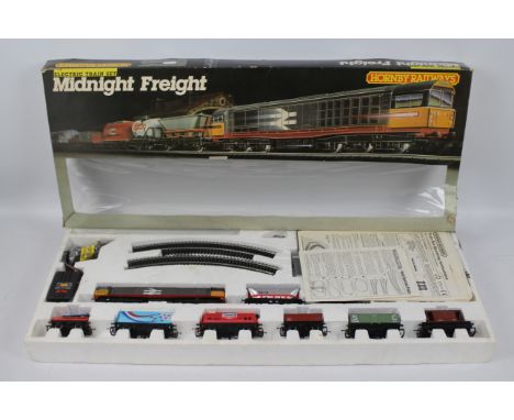 Hornby - A boxed OO gauge Electric Midnight Freight set # R.674 containing a Class 58 Diesel loco and six wagons. They appear