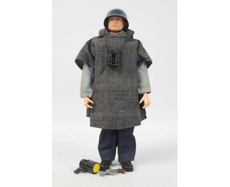 Palitoy, Action Man - A Palitoy dark brown painted hard head Action Man figure in Sailor outfit. The figure with hard hands, 