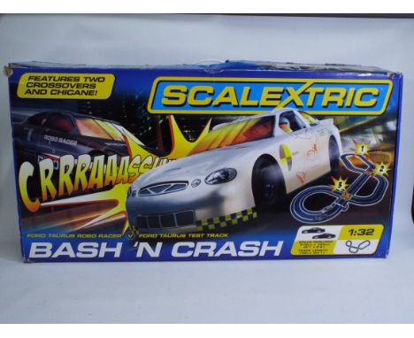 Scalextric - A boxed Scalextric 'Bash 'N Crash' racing set - The #C1259 racing set comes with 2 x 1:32 scale racing cars, 2 x