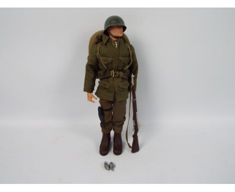 Palitoy, Action Man - A Palitoy Action Man figure in Combat Soldier attire. The dark brown painted hard head figure with hard