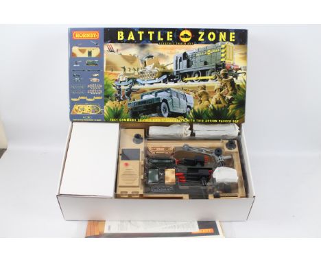 Hornby - A boxed OO gauge Battle Zone train set # T1501 including Class 08 loco and two wagons with two Army Tanks and two tr