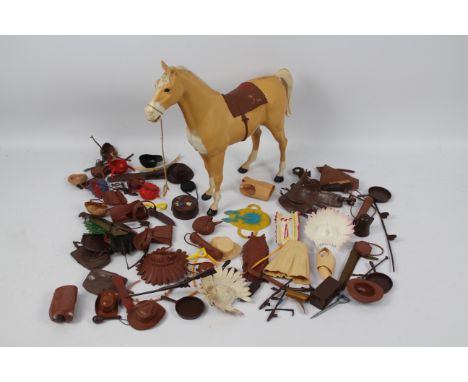 Marx - An unboxed Marx standing Palomino horse with an unboxed collection of Marx predominately Johnny West Cowboy and Indian