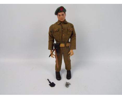 Palitoy, Action Man - A Palitoy Action Man figure wearing Green Beret in combat fatigues. The dark brown painted hard head fi