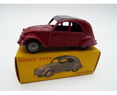 Dinky Toys (French factory) - a die-cast 2 CV Citroen, maroon body with grey roof, black base and concave hubs # 535, predomi