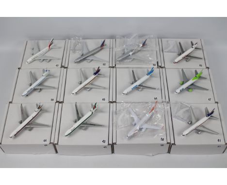 Gemini Jets and similar - A collection of 12 re-boxed diecast 1:400 scale model aircraft in various carrier liveries. No seri