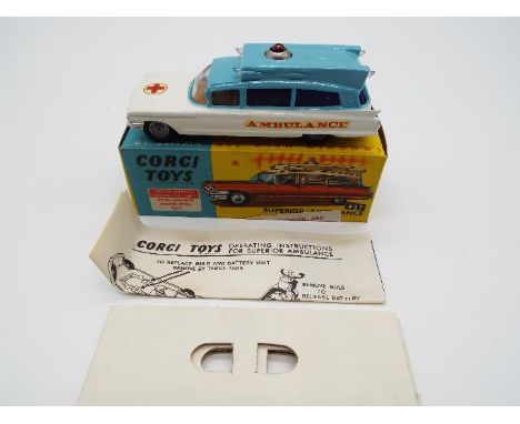 Corgi Toys - a die-cast Superior Ambulance on Cadillac chassis with battery operated flashing roof lights, pale blue and whit