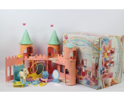 My Little Pony, Hasbro - A boxed vintage G1 My Little Pony 'Dream Castle' playset. Set includes Castle (in pink and blue), th