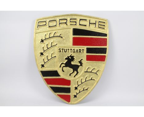 A large cast iron plaque advertising Porsche, approximate size 56.5 cm x 46.5 cm (ypors)