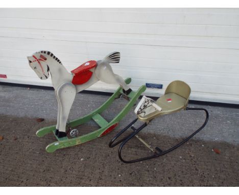 Rocking horses x 2. A 33" x 35" vintage rocking horse, static with springs and interchangeable to roll on wheels.  A 31" x 18