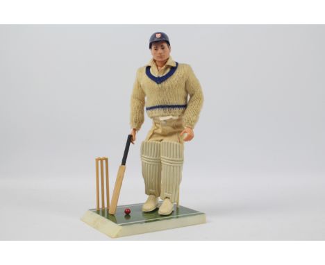 Palitoy, Action Man - A Palitoy dark brown painted hard head Action Man Cricketer. The figure with hard hands, is marked 'Mad