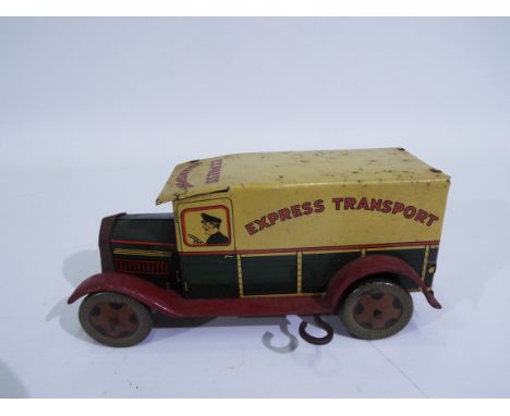 Wells O London - A clockwork tinplate Express Transport van. This model appears in Good overall condition with minimal wear a