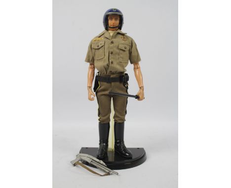 Takara - A Takara 'Combat Joe' 12" action figure in CHiPs (California Highway Patrol) outfit. The figure is marked  'Takara J