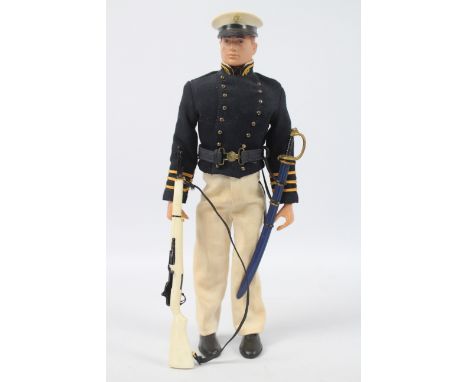 Palitoy, Action Man - A Palitoy red painted hard head Action Man figure in GI Joe 'Annapolis Cadet' outfit. The figure with h