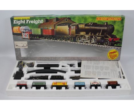 Hornby - A boxed OO gauge Electric Eight Freight set # R.540 with a class 8F 2-8-0 LMS loco and 6 x wagons. The items appear 