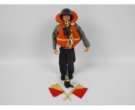 Palitoy, Action Man - A Palitoy dark brown painted hard head Action Man figure in Navy Attack outfit. The figure with hard ha