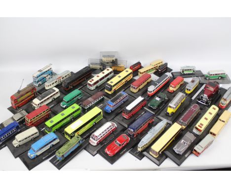 Days Gone - Lledo - Atlas and similar. In excess of 30 loose die cast model busses and trams. Unboxed and attached to platfor