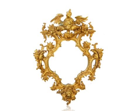 ORMOLU GILT BRASS WALL MIRROR, MOST LIKELY FRENCHthe mirror of cartouche form, featuring the bust of a winged maiden, with fo