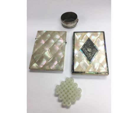 Two mother of pearl card cases, a jade item and a silver vessel (4).
