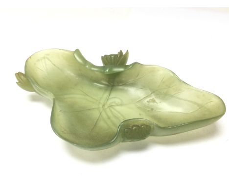 A late 19th/ early 20th century Chinese jade lotus leaf dish, 18cm long. Postage category D