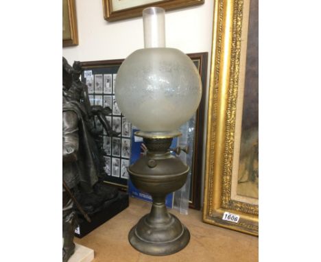 A brass oil lamp. Shipping category D.- NO RESERVE