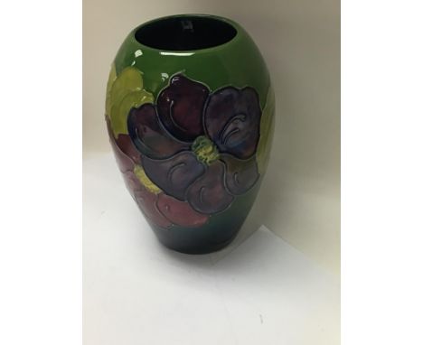 A Moorcroft vase Heartsease viola pattern. 14 cm .