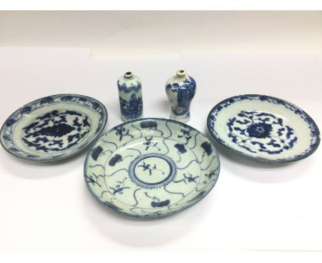 Five blue and white ceramic items comprising two perfume bottles and three dishes, largest diameter approx 16cm. Shipping cat