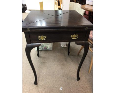 A Edwardian mahogany envelope card table with single drawer on cabriole legs .