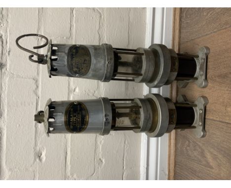 A pair of A Spiralarm Type S miners lamp, for The Detection of Combustible Gases, J H Naylor Ltd of Wigan, 36cm high. (D)