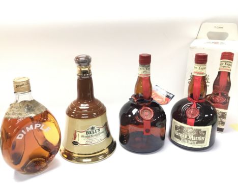 A Collection of liquor and whiskey including boxed Grand Marnier, Bells blended Scotch whisky, Dimple old blended. Postage ca