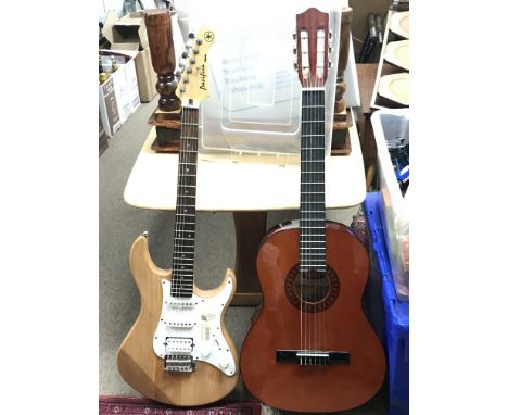 A Stagg classical guitar & a Yahama Pacifica 112 electric guitar with an alder body and HSS configuration, in unplayed condit