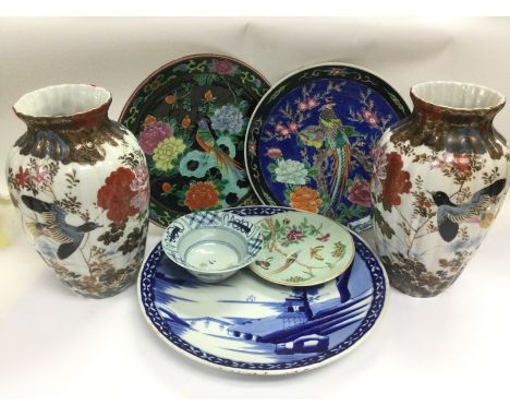 A collection of Oriental ceramic comprising a pair of vases decorated with birds, approx height 31cm, three chargers, blue an