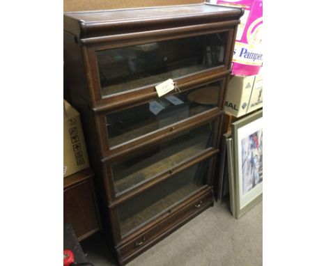 A Globe Wernick four tier bookcase, approx 86.5cm x 30cm x 46.5cm. Shipping category D.