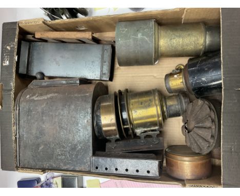 A box of mixed magic lantern parts.