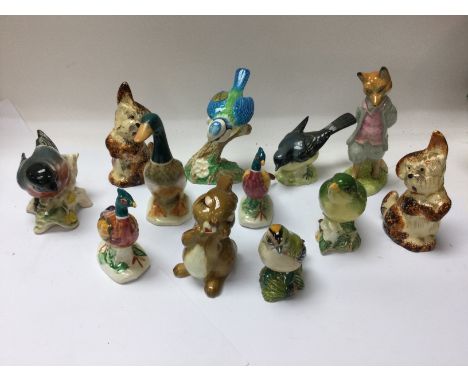 A collection of Beswick birds and other ceramic animal figures.