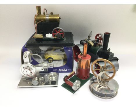 A Mamod steam engine and additional traction units, some N gauge trains and a boxed die cast model of a BMW Isetta. Shipping 