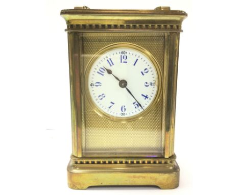 A brass cased carriage clock, 6x8x11.5cm Postage category D