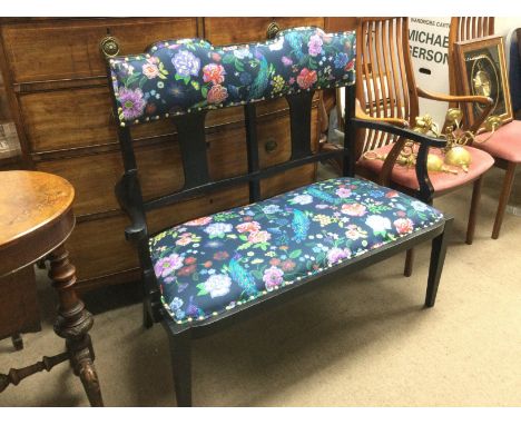 An Edwardian floral upholstered sofa. Shipping category D.