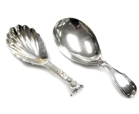Two silver caddy spoons, comprising a Victorian caddy spoon with shell fluted bowl and shaft embossed with cherub's heads, Lo