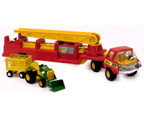 A Tonka fire tender, number 23, together with a tractor and trailer. (3)