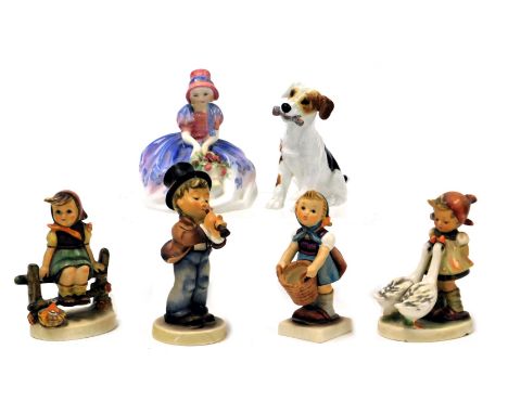 A Royal Doulton figure modelled as Monica, HN1467, Royal Doulton figure of a terrier, HN1159, and four Hummel figures. (6)(AF