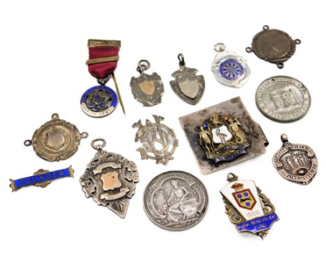 A Midland Counties General Trades Exhibition silver medal, engraved as awarded to Farleigh &amp; Hall, further silver and ena