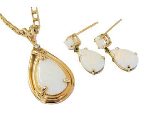 A 9ct gold opal and diamond pendant, on a curb link neck chain, together with a pair of matching drop earrings, 5.3g. 