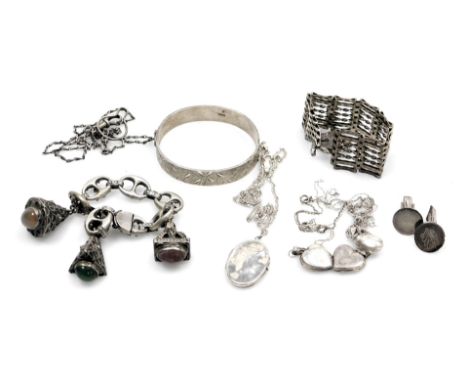 A group of silver and other costume jewellery, comprising bangle, cufflinks, gate bracelet, various lockets and chains, etc.,