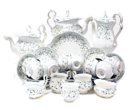 A Royal Albert porcelain Caroline pattern tea and coffee service, comprising pair of teapots, coffee pot, bread plate, cream 
