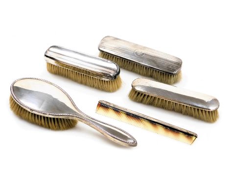 A George V silver backed clothes brush, with engine turned decoration, circular reserve, initial engraved, Birmingham 1916, t
